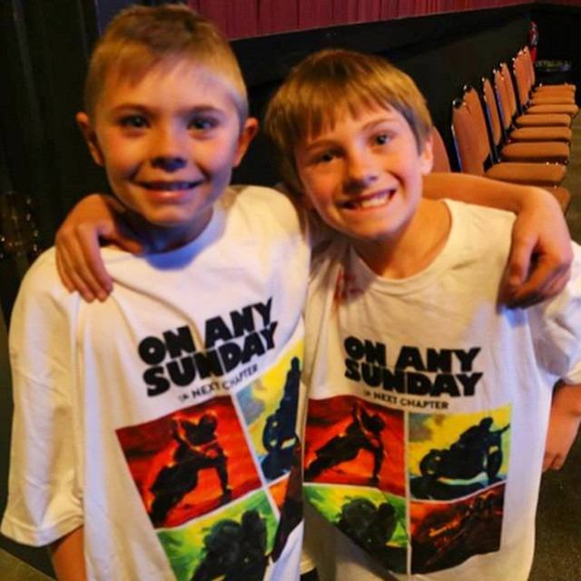 The campaign art, on kids' backs at the premiere